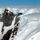 Ice tumbling over the Crescent Scarp’s 4,600-foot cliffs near Fleming Glacier on the western Antarctic Peninsula. Photo: NASA/John Sonntag